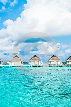 tropical Maldives resort hotel and island with beach and sea for holiday vacation concept