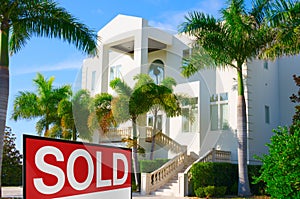 Tropical mansion house w SOLD sign photo