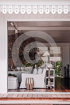 Tropical modern beach house white tone living room interior