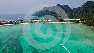 Tropical panoramic landscape with boat in the ocean at Phi Phi islands in Thailand.