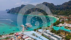 Tropical panoramic landscape with a ferry pier at Phi Phi islands in Thailand.