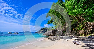 Tropical Papaya beach at paradise coast, El Nido, Palawan, Philippines. Tour A Route. Coral reef and sharp limestone cliffs