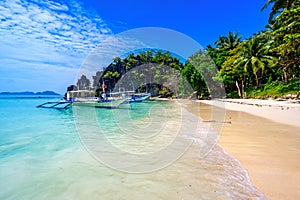 Tropical Papaya beach at paradise coast, El Nido, Palawan, Philippines. Tour A Route. Coral reef and sharp limestone cliffs