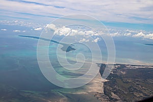 Tropical paradise beautiful islands viewed from above, aerial view on crystal clear turquoise blue and green waters, Mozambique