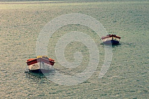 Tropical paradise typical scenery: colored wooden boats docked in the sea. Miches Bay or Sabana De La Mar lagoon, northern