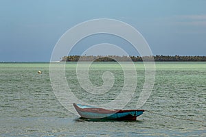 Tropical paradise typical scenery: colored wooden boats docked in the sea. Miches Bay or Sabana De La Mar lagoon, northern