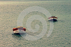 Tropical paradise typical scenery: colored wooden boats docked in the sea. Miches Bay or Sabana De La Mar lagoon, northern photo