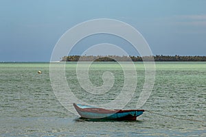 Tropical paradise typical scenery: colored wooden boats docked in the sea. Miches Bay or Sabana De La Mar lagoon, northern photo
