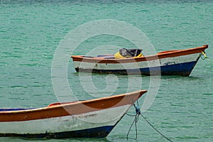 Tropical paradise typical scenery: colored wooden boats docked in the sea. Miches Bay or Sabana De La Mar lagoon, northern photo