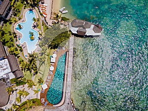 tropical pool with beach chairs and umbrellas, swimming pool in Mauritius