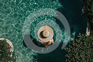 Tropical Pool Paradise: Aerial Photo of Woman in Hat Enjoying Summer