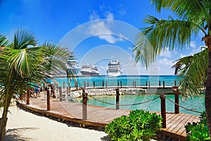 Tropical resort with cruise ships in port