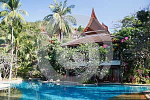 Swimming pool at a resort in Phuket, Thailand. Nice green garden suronding