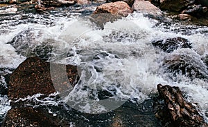 Tropical river flowing rapid water and rocks landscape