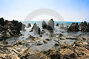 Tropical rocky beach in Arambol, Goa, India