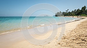 Tropical sandy beach with azure waters