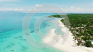 Tropical sandy beach and blue sea. Philippines