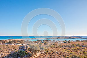 Tropical sandy beach with turquoise water, in Elafonisi, Crete, Greece. Elafonissi beach with pink sand