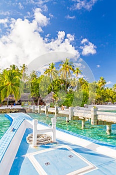 Tropical scene with traditional wooden boat in Maldives, called Dhoni