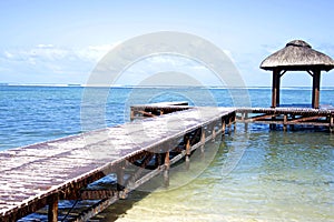 Tropical sea and beach. Empty wooden pier