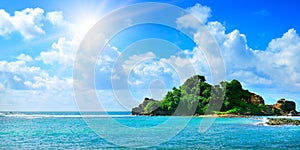 Tropical sea and sun on blue sky background. Wide photo