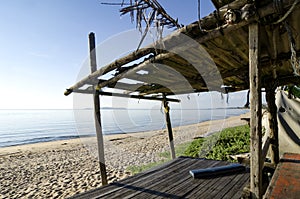 Tropical sea view under wooden hut at sunny day. sandy beach and