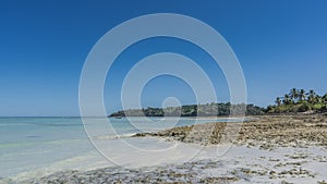 Tropical seascape. Low tide. The rocky seabed was exposed.