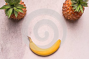 Tropical and Seasonal Summer Fruits. Pineapple and Bananas Arranged in smile face, Healthy Lifestyle. Flat Lay