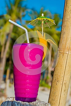 Tropical shake, refreshment drink in glass on tropical