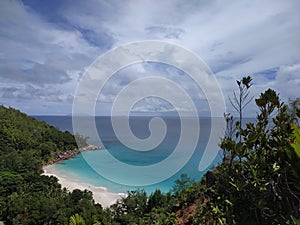 Tropical shore sightseen with cloudy sky at Praslin photo