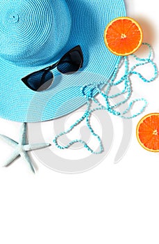 Tropical Summer Beach Background. Sunglasses, hat with starfish on white summer background. Travel. Summer concept