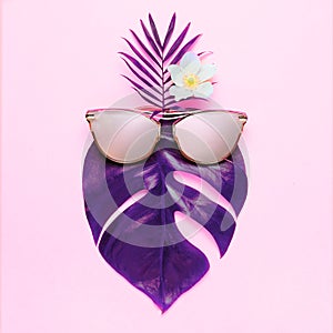 Tropical summer fun concept. Trandy hipster n pink glasses. Creative poster - neon bright background. Trendy style