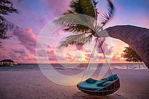 Tropical sunset beach sky background as exotic summer landscape beach swing or hammock and white sand and calm sea beach banner.