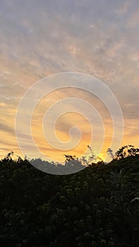 Tropical sunset with cloud striations