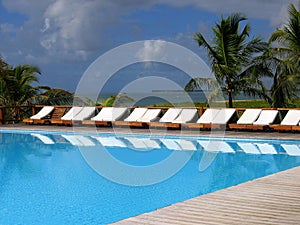 tropical swimming pool by the sea