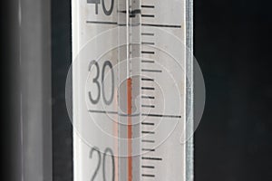 Tropical temperature of 34 degrees Celsius, measured on an outdoor thermometer