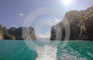 Tropical Thai jungle lake Cheo lan wood boat, wild mountains nature national park ship yacht rocks