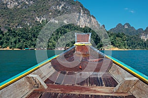 Tropical Thai jungle lake Cheo lan wood boat, wild mountains nature national park ship yacht rocks