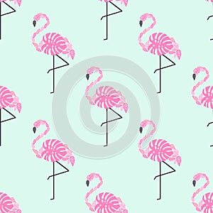 Tropical trendy seamless pattern with pink decorative flamingos from palm leaves on mint green background.