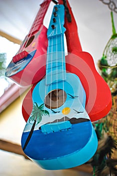 Tropical ukelele photos in blue and red color.