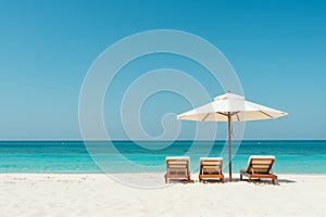 tropical vacation background. Sundbeds under the sun shade on sandy tropical beach