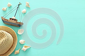 Tropical vacation and summer travel image with sea life style objects over pastel mint blue background. Top view