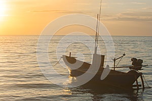 Tropical view of sea and fishing boats with sunset light at Chao Lao Beach.