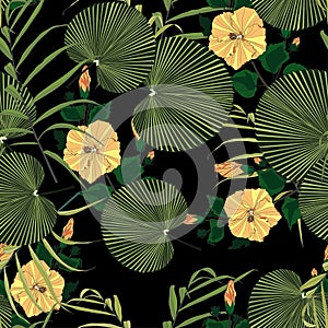 Tropical vintage yellow hibiscus floral green leaves seamless pattern black background.