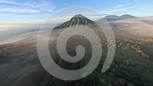 Tropical volcano island mountain fog landscape early morning environment aerial panorama view