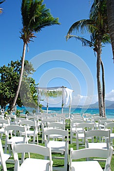 Tropical Wedding by the sea / ocean beach with chairs