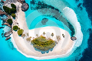 Tropical white sand on the beach and turquoise sea water. View from the top. A tropical paradisiacal backdrop