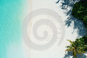 Tropical white sand on the beach and turquoise sea water. View from the top. A tropical paradisiacal backdrop