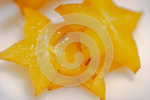 Tropical yellow fruit sliced on the plate