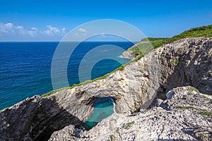 Trou au diable, natural arch in the cliffs of Marie Galante photo